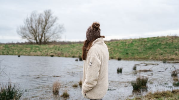 Hannah observing by the lake