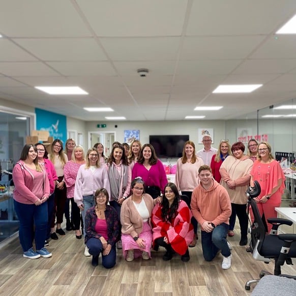 Jess and the team on 'Wear it pink' day in 2022