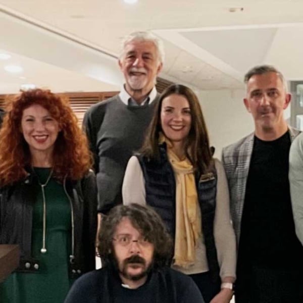 Photo of Lisa with the team in Milan at a trade show